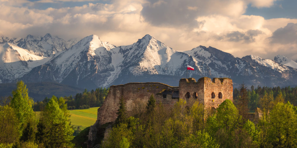 Castle in Czorsztyn against the background of snowy Tatra mountains, Poland